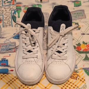 On Running White and Black Athletic Shoes